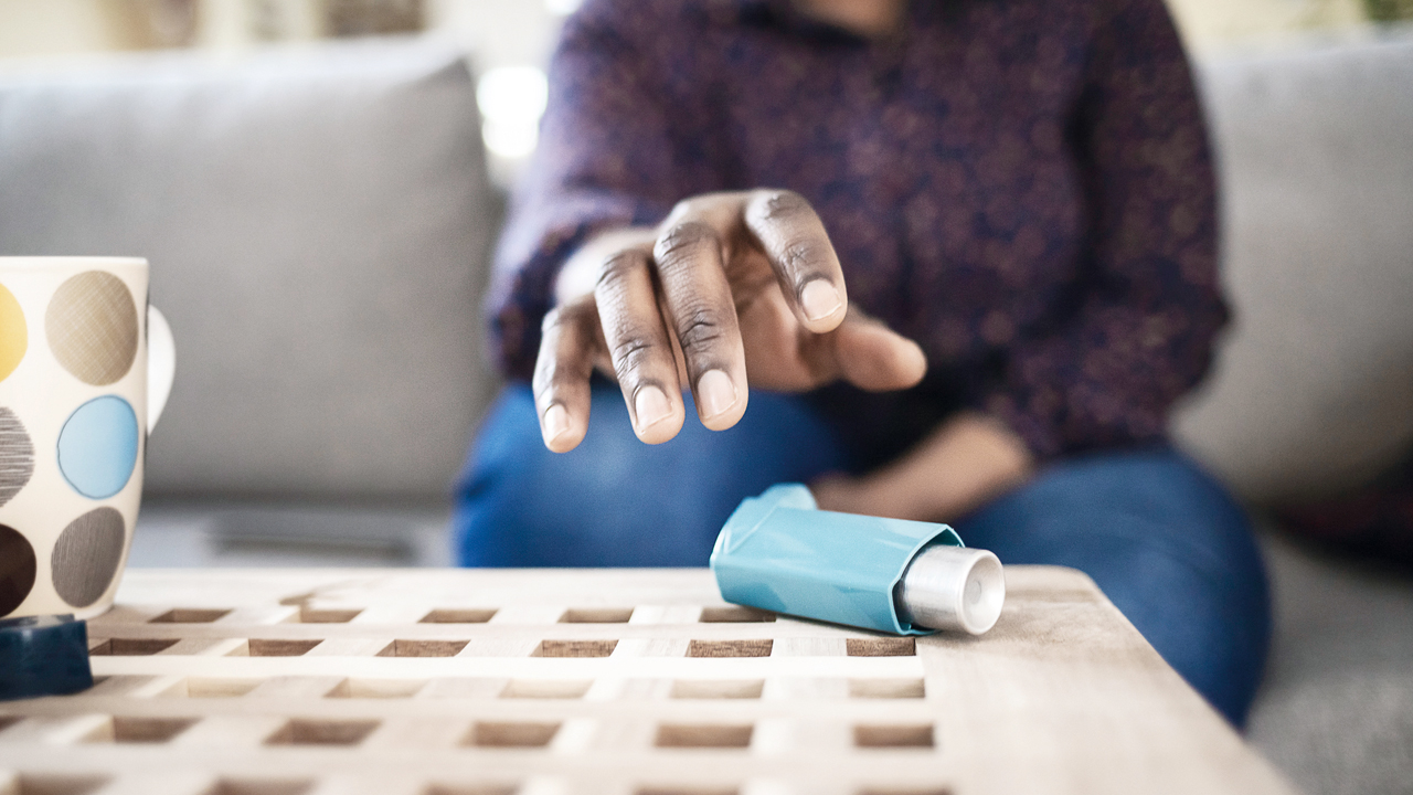 man reaching for reliever inhaler p16.jpg